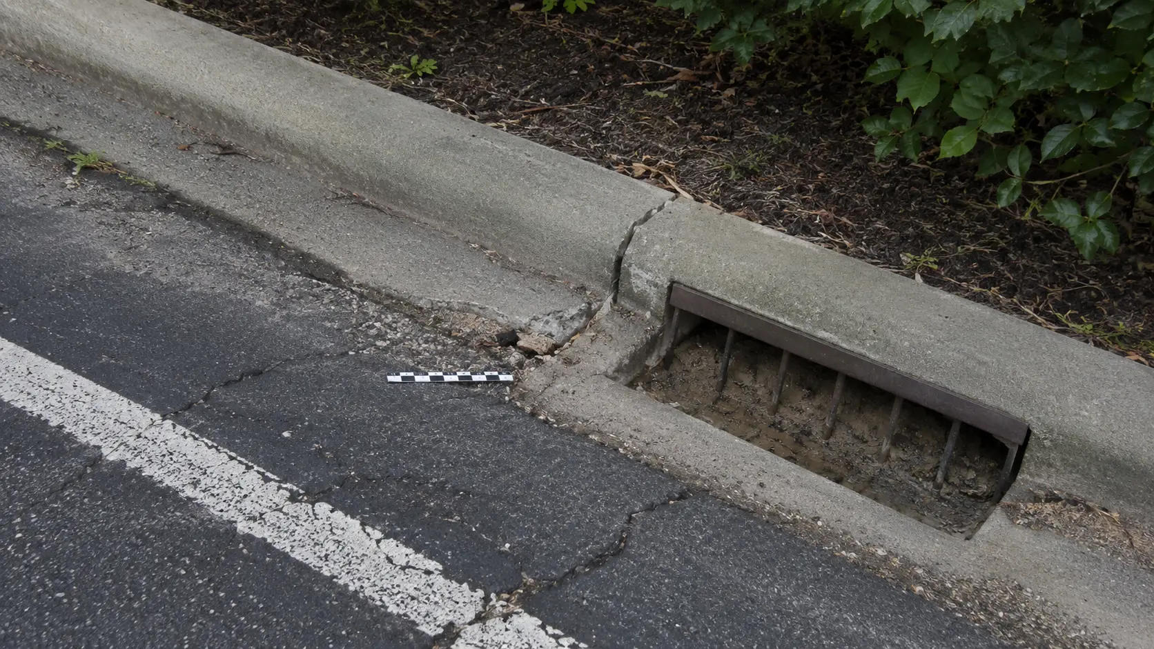 Detailed condition record of a curb, pavement edge, and drainage inlet